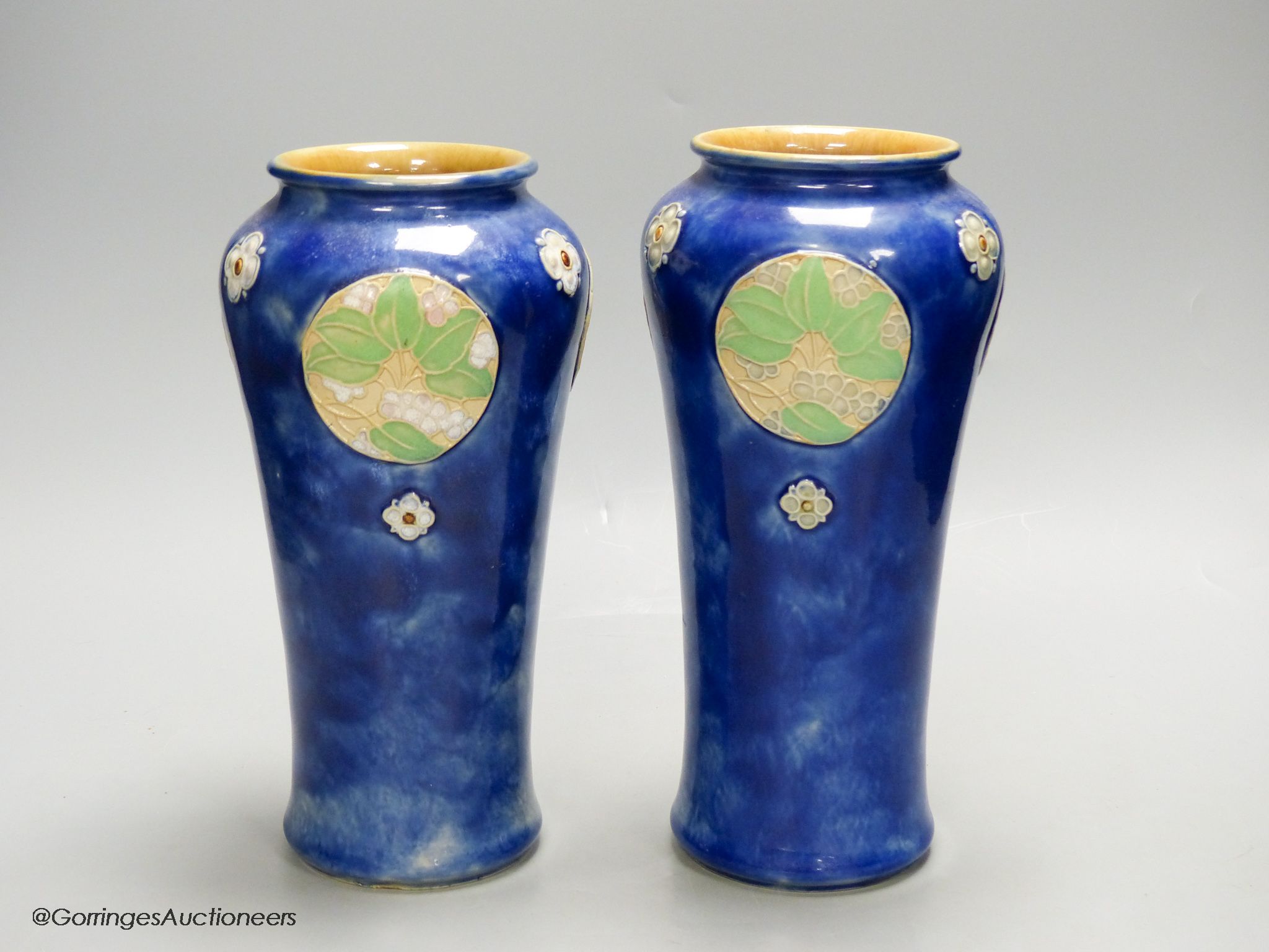 A pair of Royal Doulton blue glazed vases, height 24.5cm